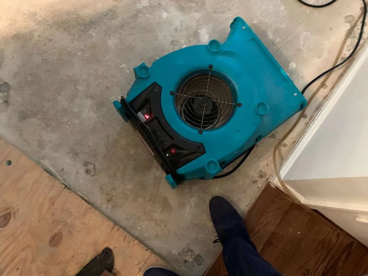 Air mover drying subfloor during Leak Detection & Repair in Sun Village